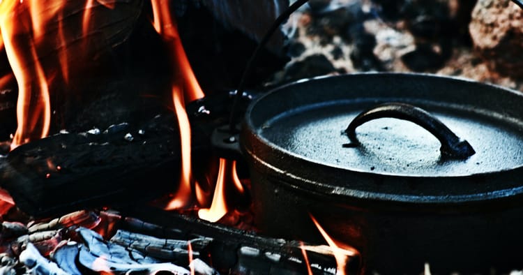 A cookpot amid the coals